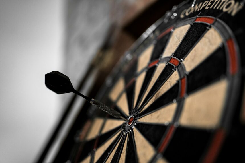 a dart board for an article discussing luke littler vs phil taylor