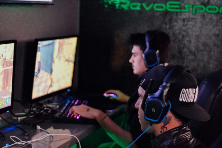 Gamers playing on a desktop PC for the top esports betting markets of 2025
