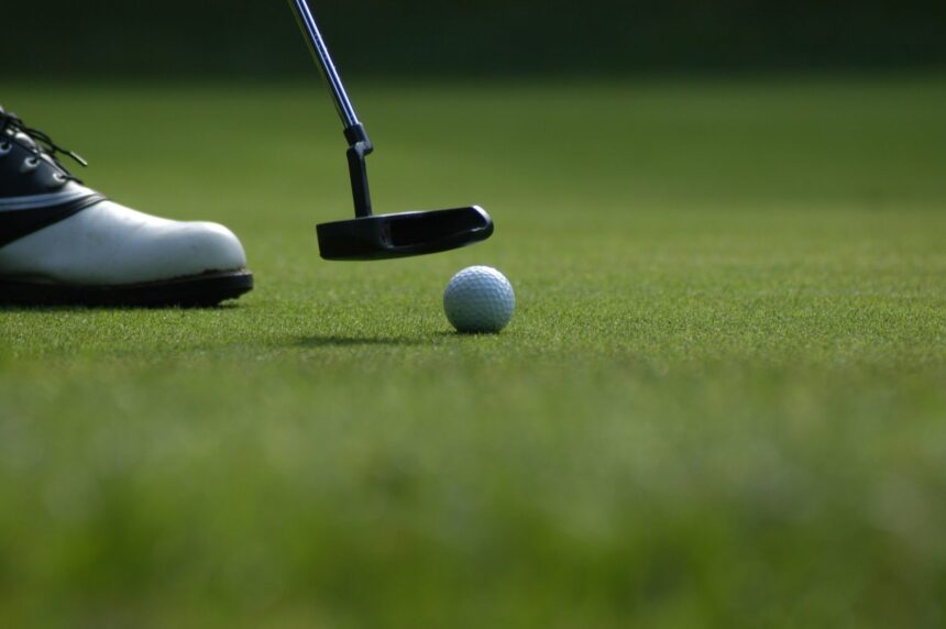 A putter and golf ball showing when is the pga championship